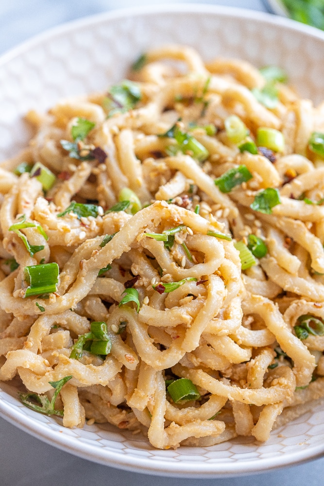 close up of a bowl of 20 minute ginger tahini noodles