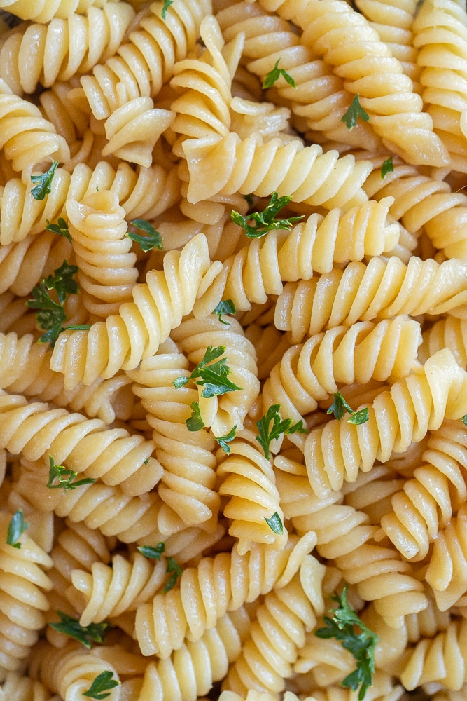 close up of kid friendly butter noodles with parsley