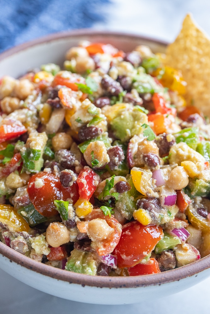 close up of loaded black bean salad in a bowl