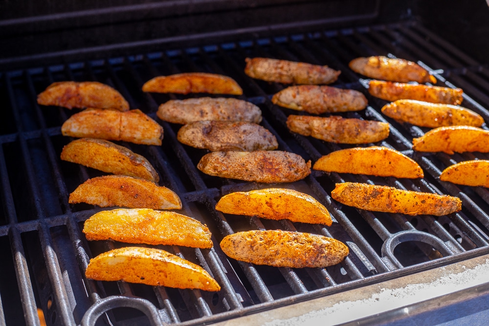seasoned potato wedges on the grill