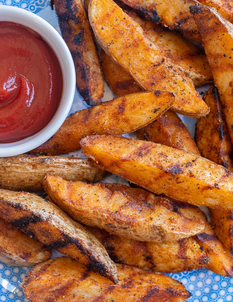 close up of seasoned grilled potato wedges