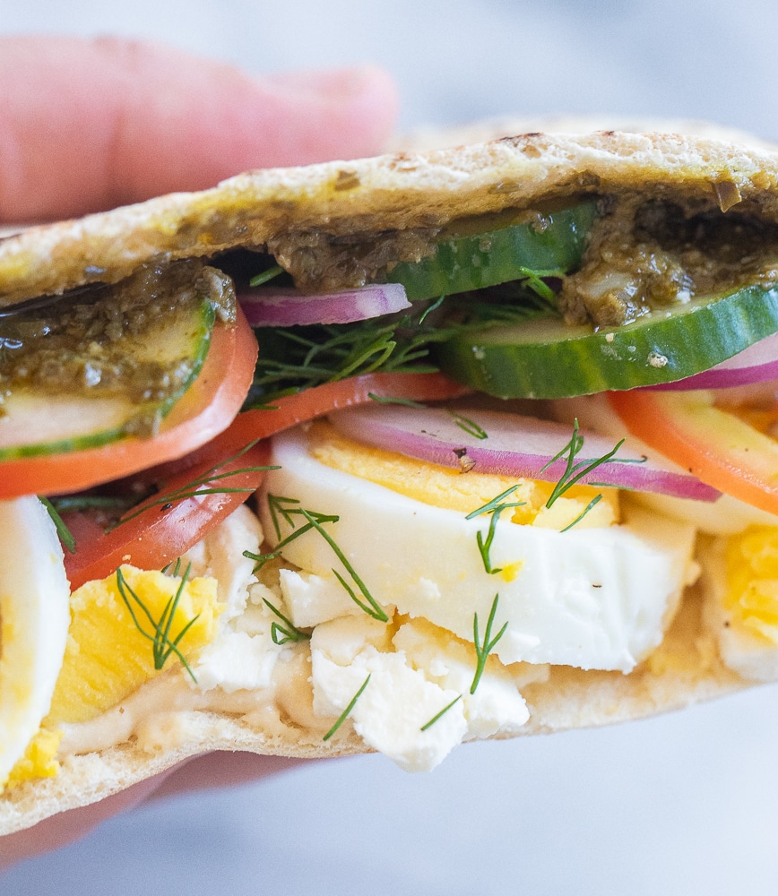 close up of a vegetarian breakfast pita with fresh herbs