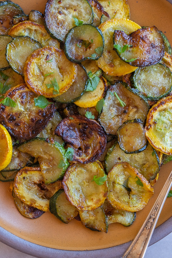 close up of a plate of caramelized pan fried summer squash