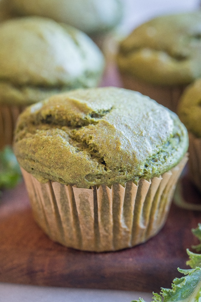 close up of a healthy green muffin on a cutting board