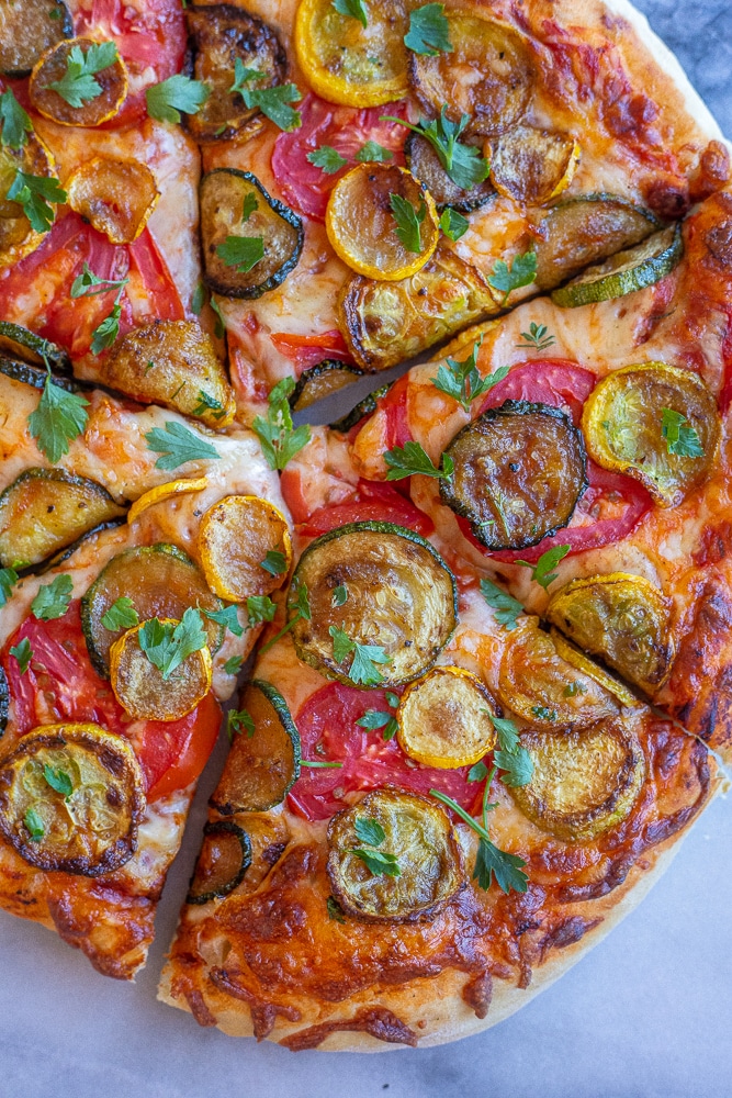 close up of a summer tomato pizza with squash