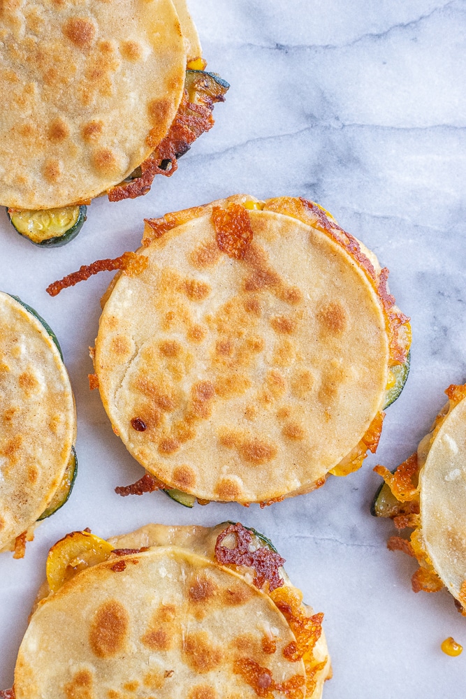 brown and crispy quesadillas on a cutting board