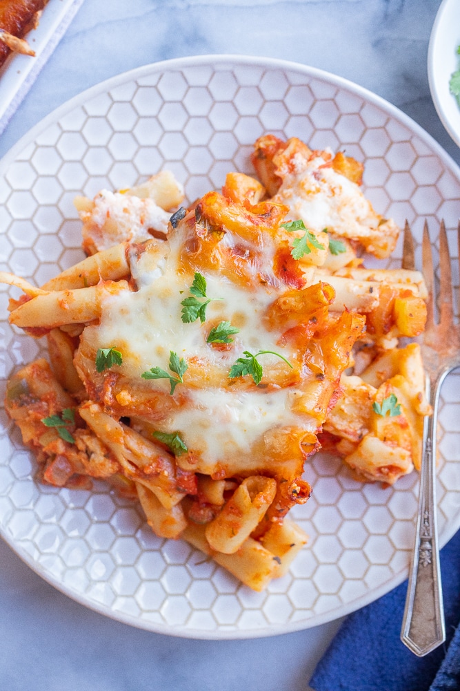 vegetarian baked ziti on a plate with a fork