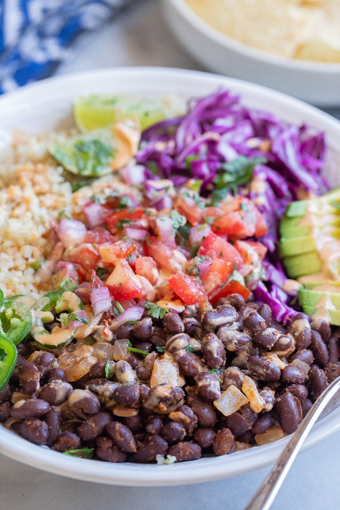 close up of seasoned black beans in the quinoa bowls