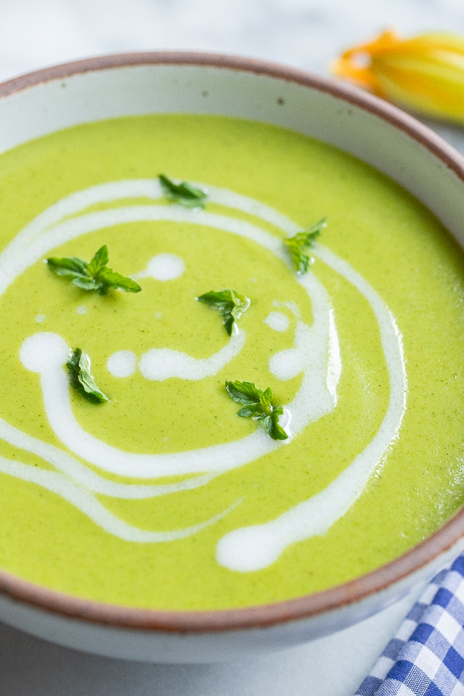 close up of a bowl of coconut curry zucchini soup