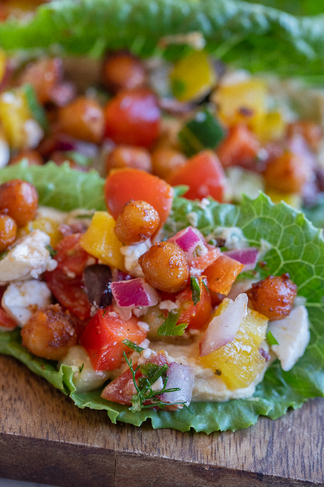 close up of a lettuce wrap with chickpeas