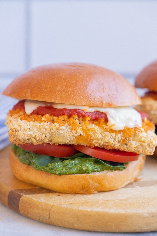 vegetarian tofu parmesan sandwich on a cutting board
