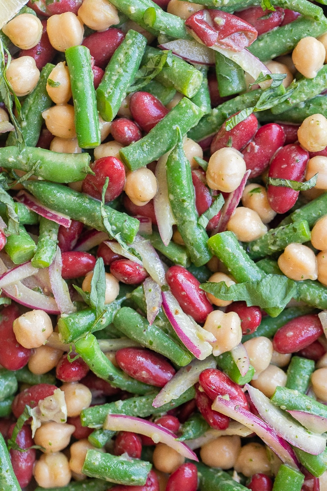 up close photo of three bean salad with basil