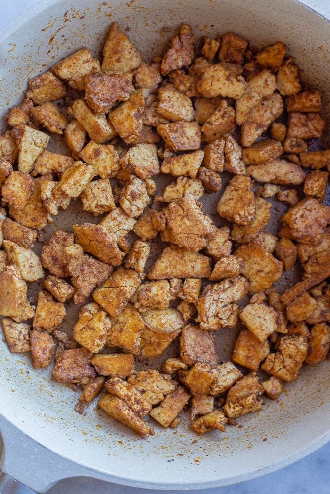 blackened tofu cooked in a frying pan