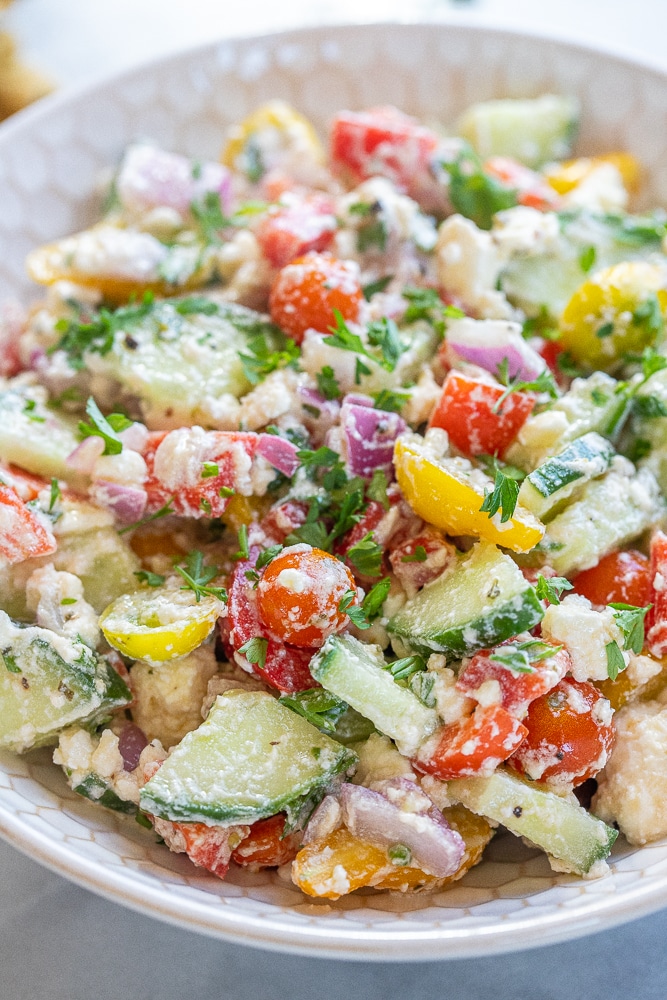 close up of a bowl of feta and summer vegetable salad