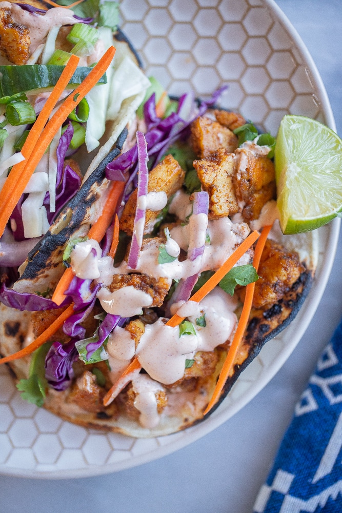 tofu tacos drizzled in my favorite fish taco sauce recipe