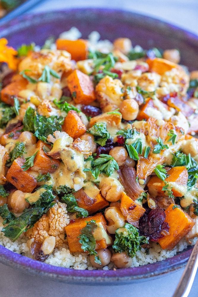 close up of a nourishing buddha bowl with roasted veggies