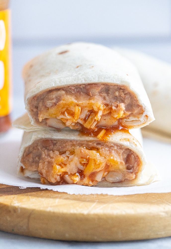 two copycat Taco Bell bean burritos stacked on top of each other