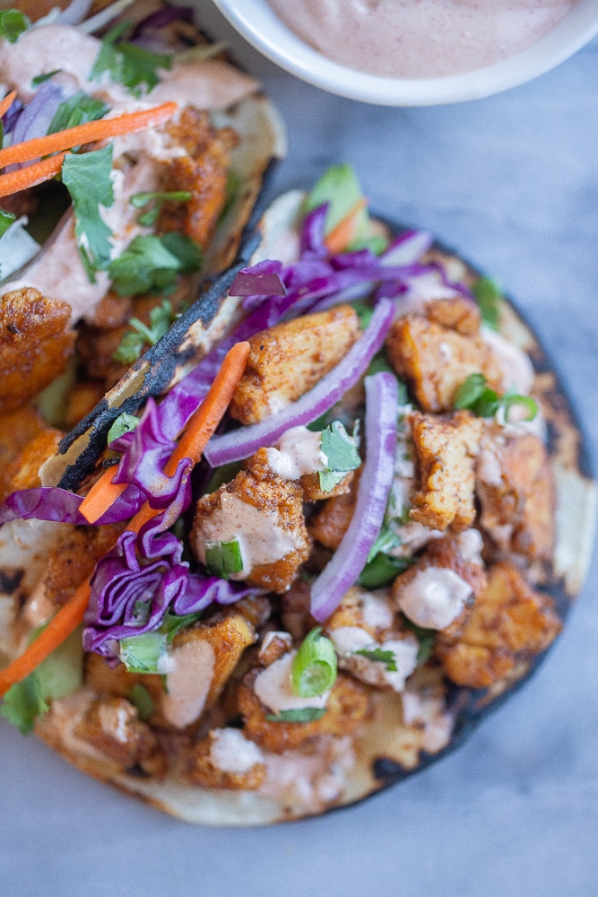 close up of a blackened tofu taco on a plate