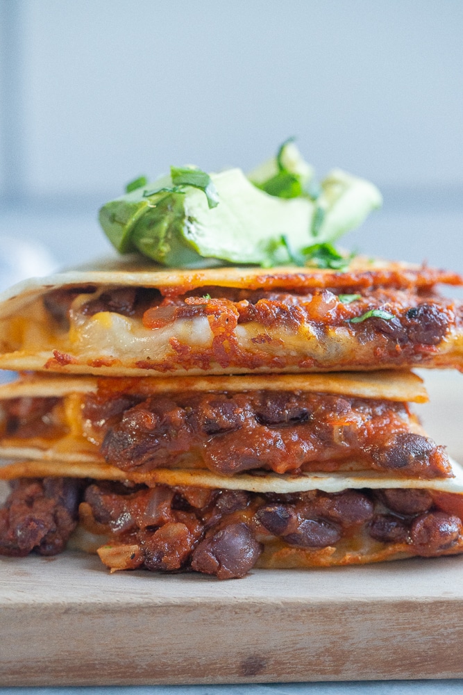 close up of a stack of bbq black bean quesadillas