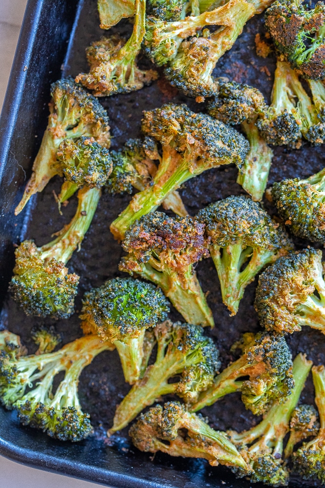 sheet pan full of brown and crispy roasted broccoli