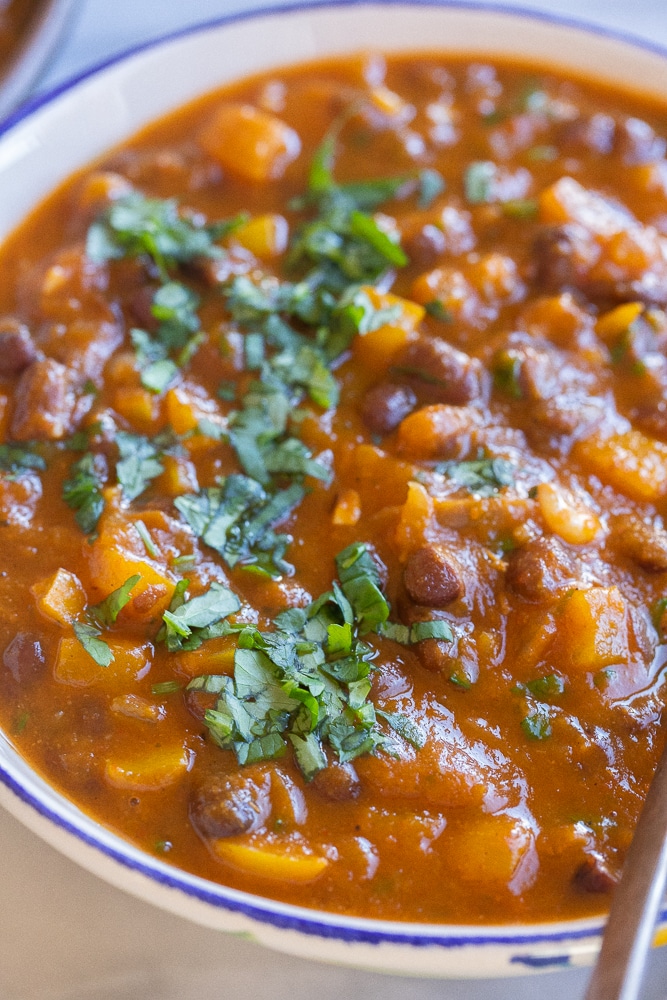 close up of a bowl of hearty vegan pumpkin chili with black beans