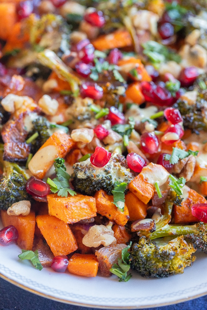 close up of the roasted broccoli with sweet potatoes, walnuts and pomegranate seeds