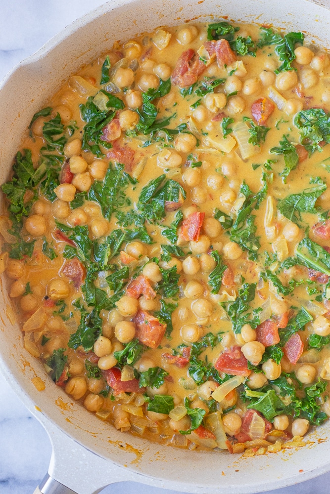 pan of chickpea coconut curry with kale