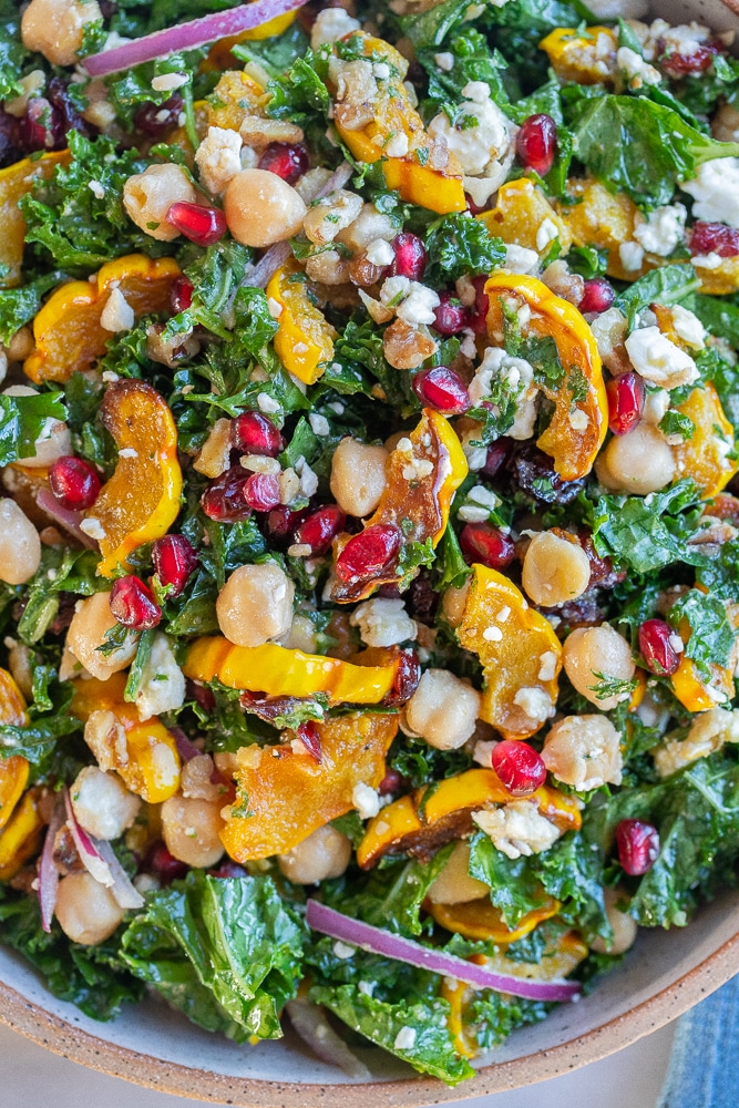 close up of a hearty winter salad with roasted squash and feta cheese