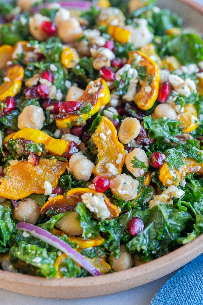 close up of roasted delicata squash salad with kale and chickpeas