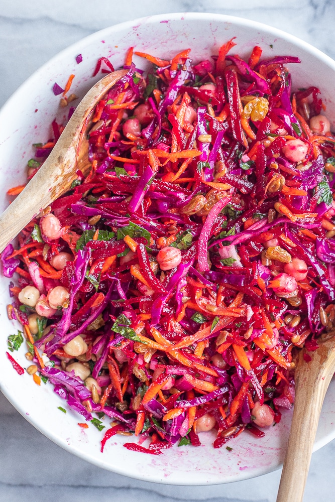 bowl of shredded beet and carrot salad with chickpeas mixed together