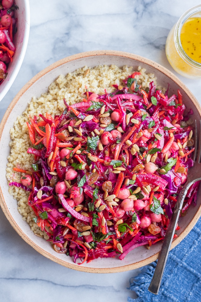 bowl of beet and carrot salad with a side of quinoa