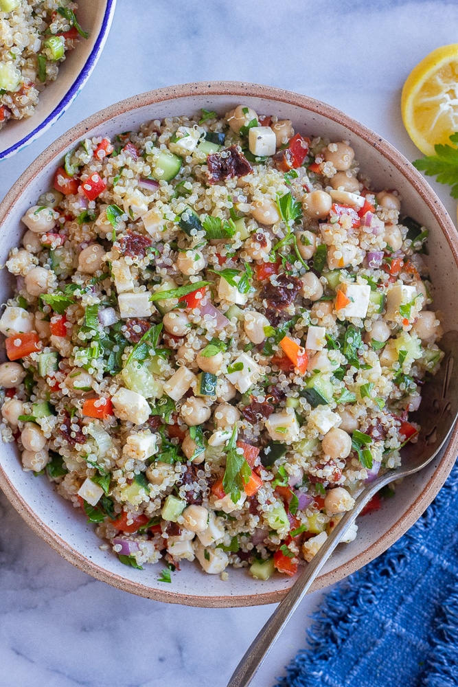 A large bowl of easy quinoa salad with chickpeas and feta cheese
