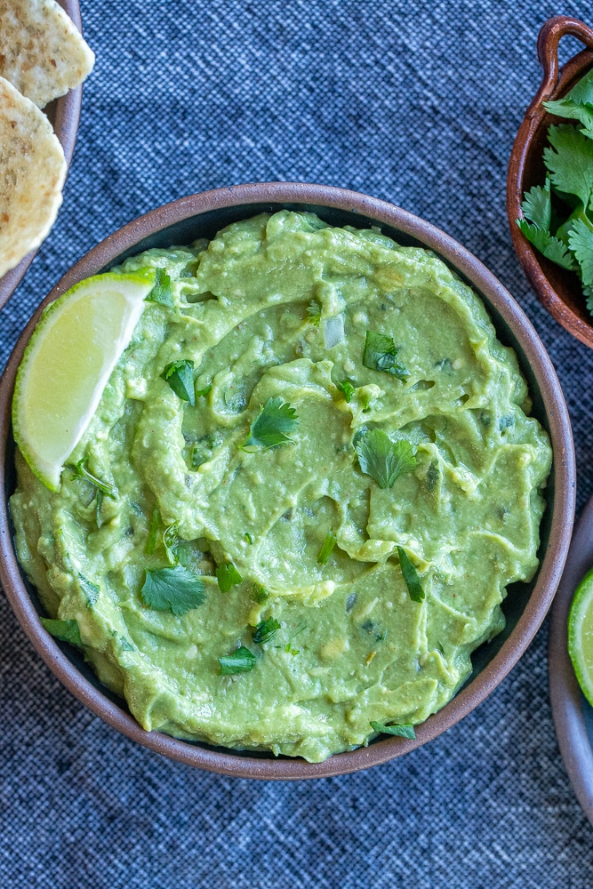 favorite guacamole recipe in a bowl with tortilla chips