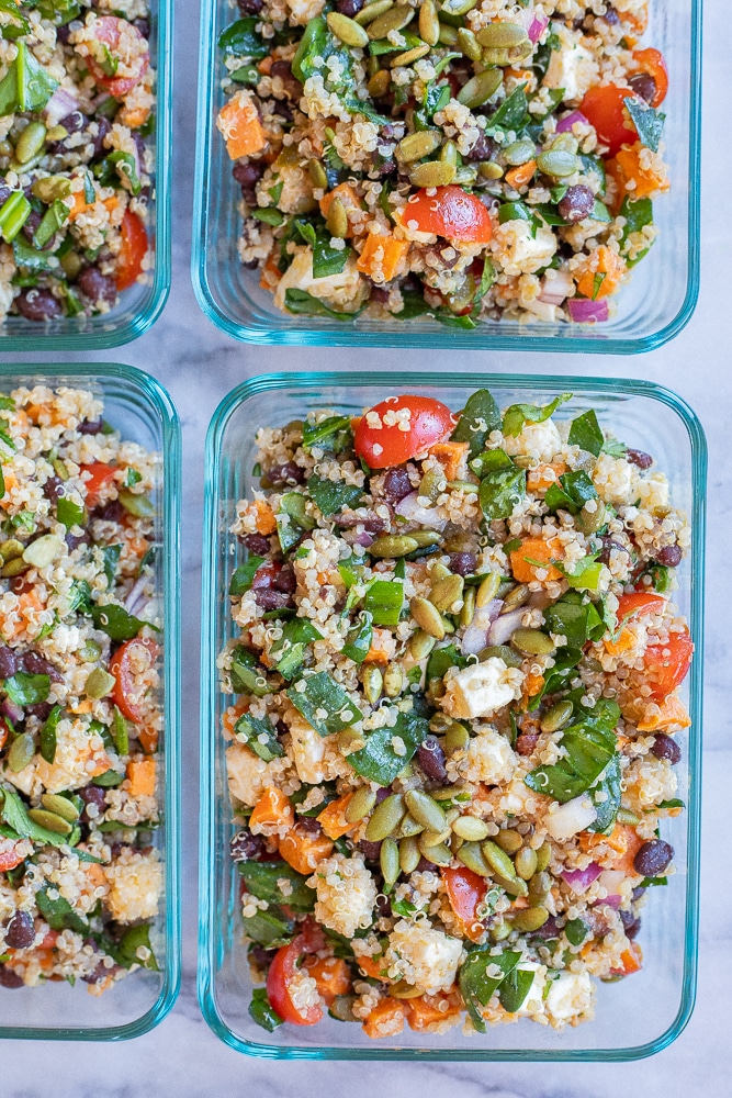 loaded quinoa and sweet potato salad in meal prep containeres