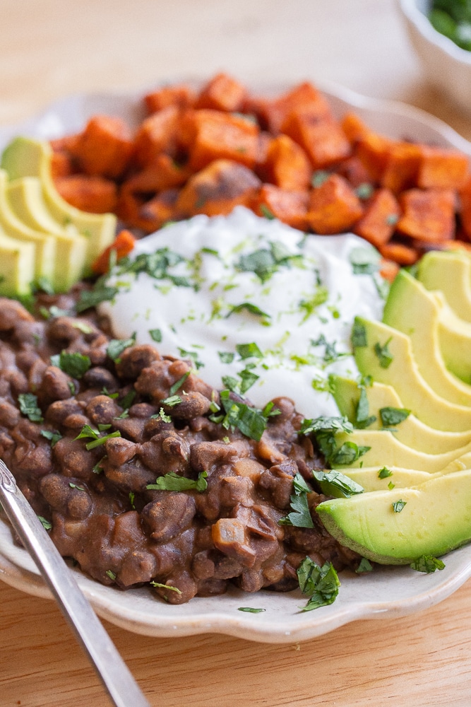 close up of a sweet potato and black bean bowl with cottage cheese