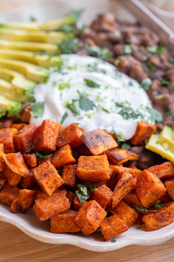 close up of the roasted sweet potato in these protein packed vegetarian bowls