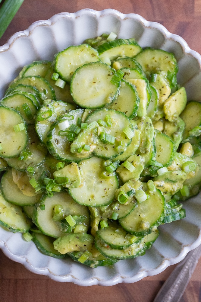 serving bowl filled with fresh avocado and cucumber salad