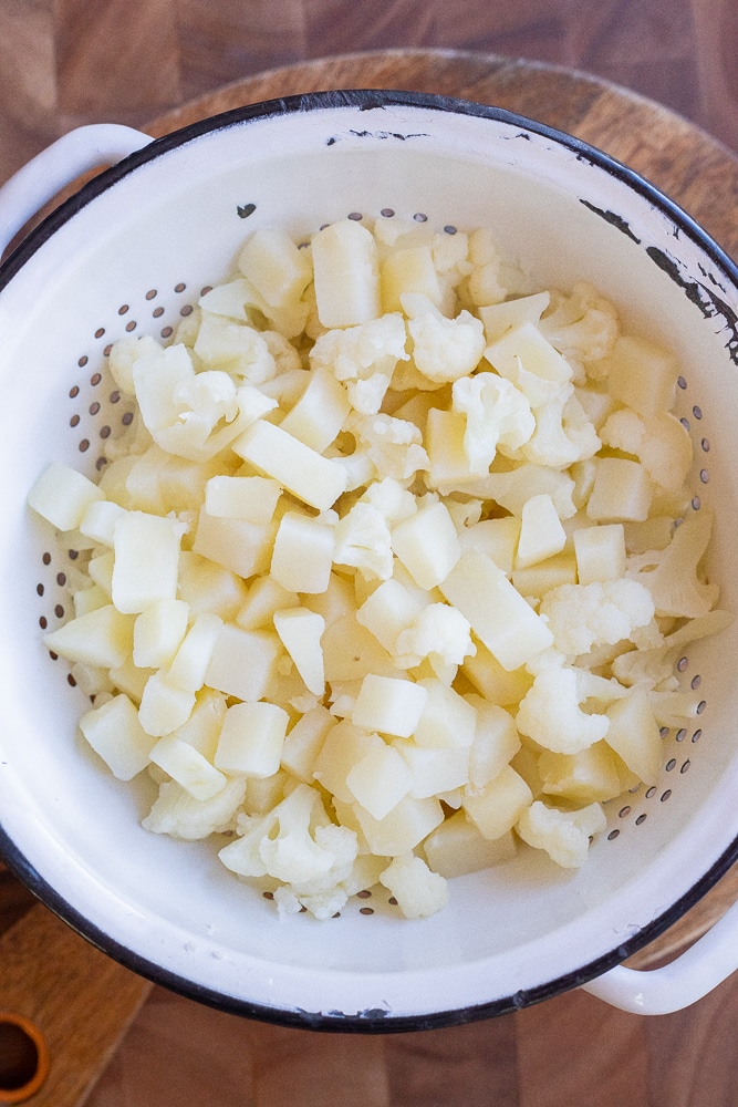 boiled potatoes and cauliflower in a collander