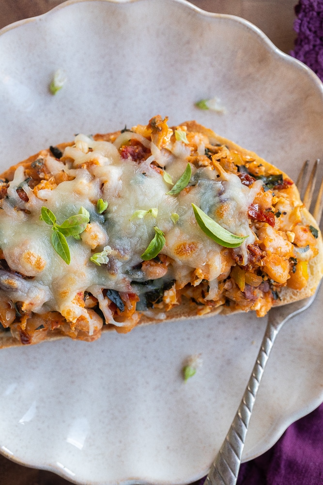 close up of a piece of cheesy Tuscan white bean toast