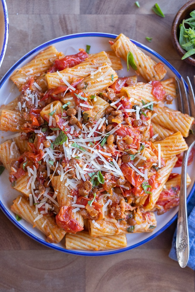 Plateful of hearty vegetarian balsamic lentil pasta with parmesan cheese