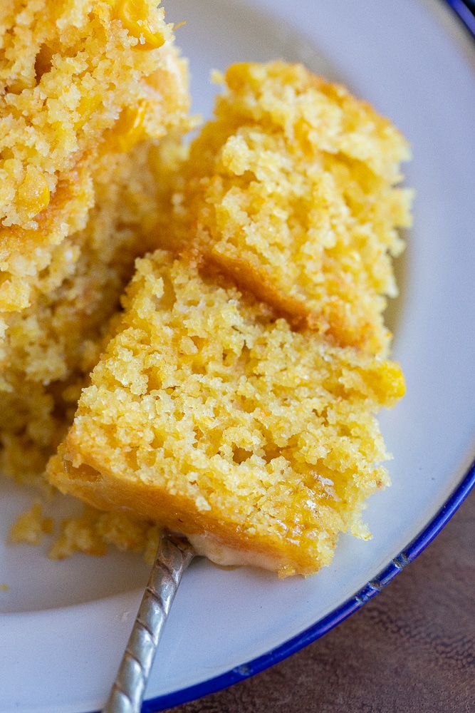 close up of a bite of cornbread on a fork