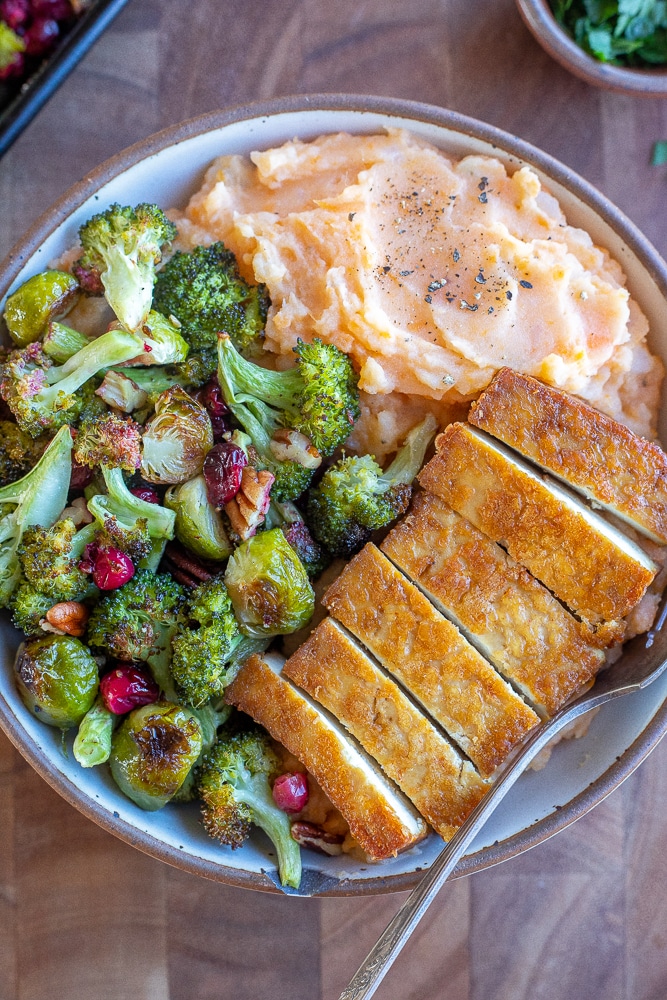 vegetarian thanksgiving bowl with tofu, veggies and mashed potatoes