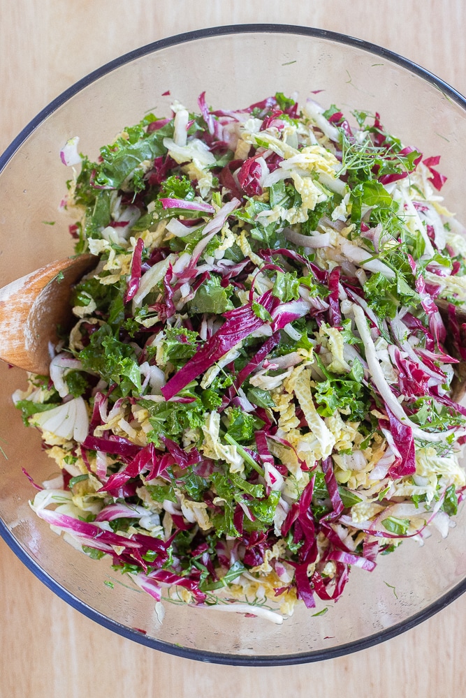 coleslaw greens all mixed together in a bowl