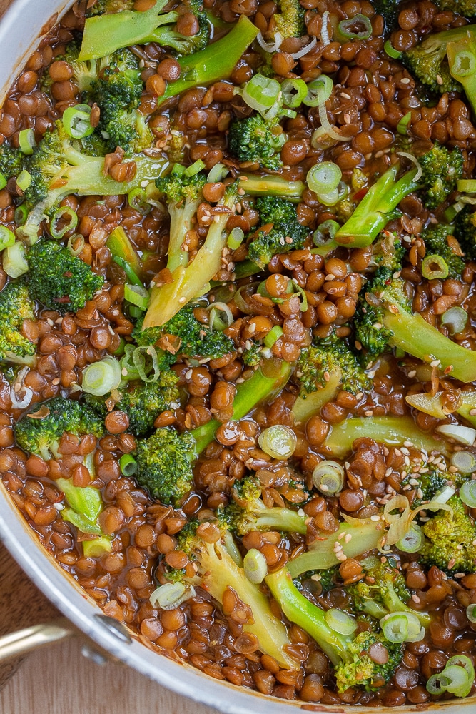 Lentil and broccoli stir fry topped with green onion