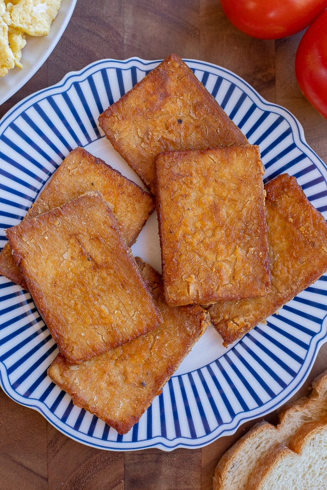 plate with crispy tofu bacon on it