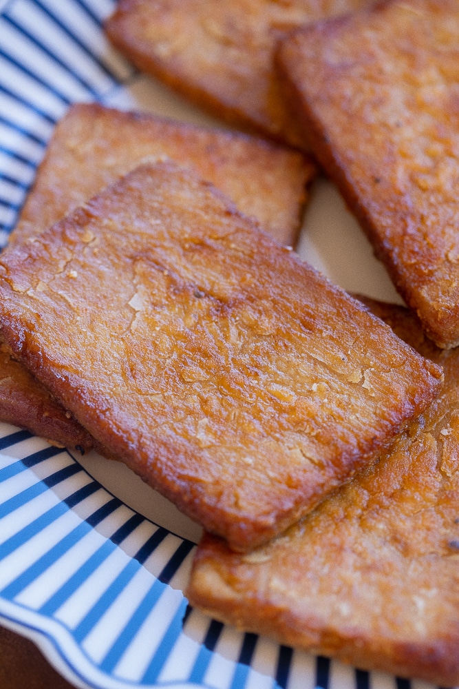 close up of a slice of smoky tofu bacon