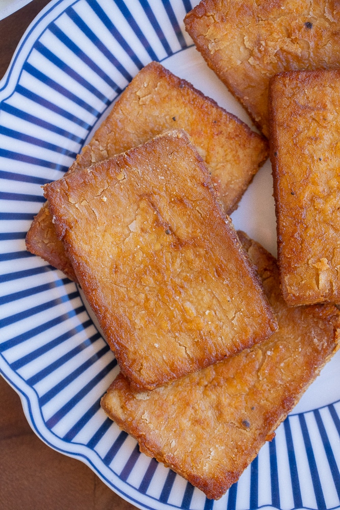 close up of a piece of crispy tofu bacon