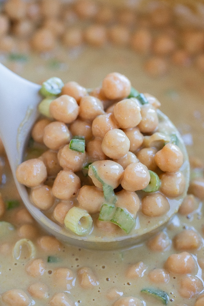 soup ladle full of curried chickpeas