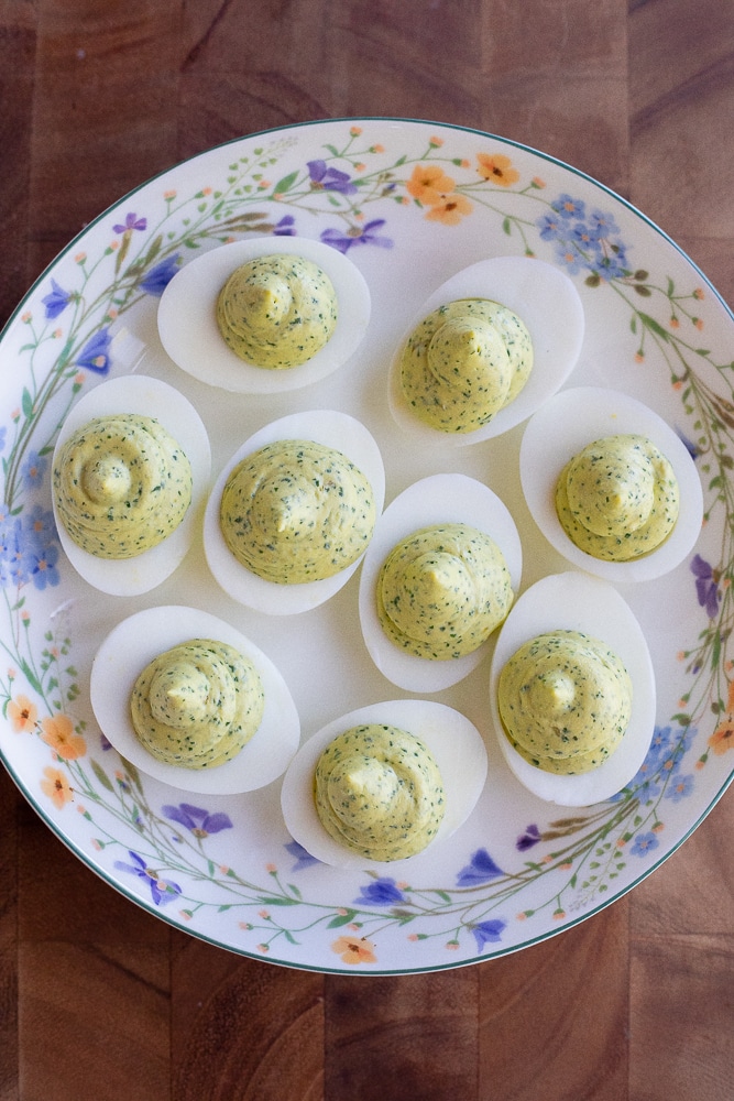 Green goddess deviled eggs on a plate