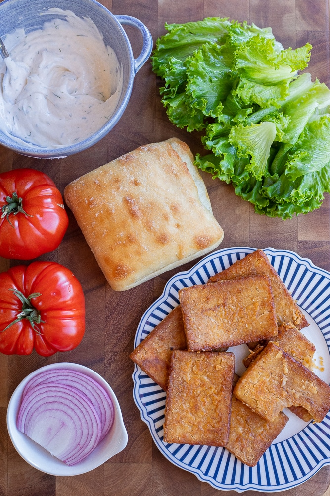 showing all the ingredients needed to make these vegan BLT sandwiches